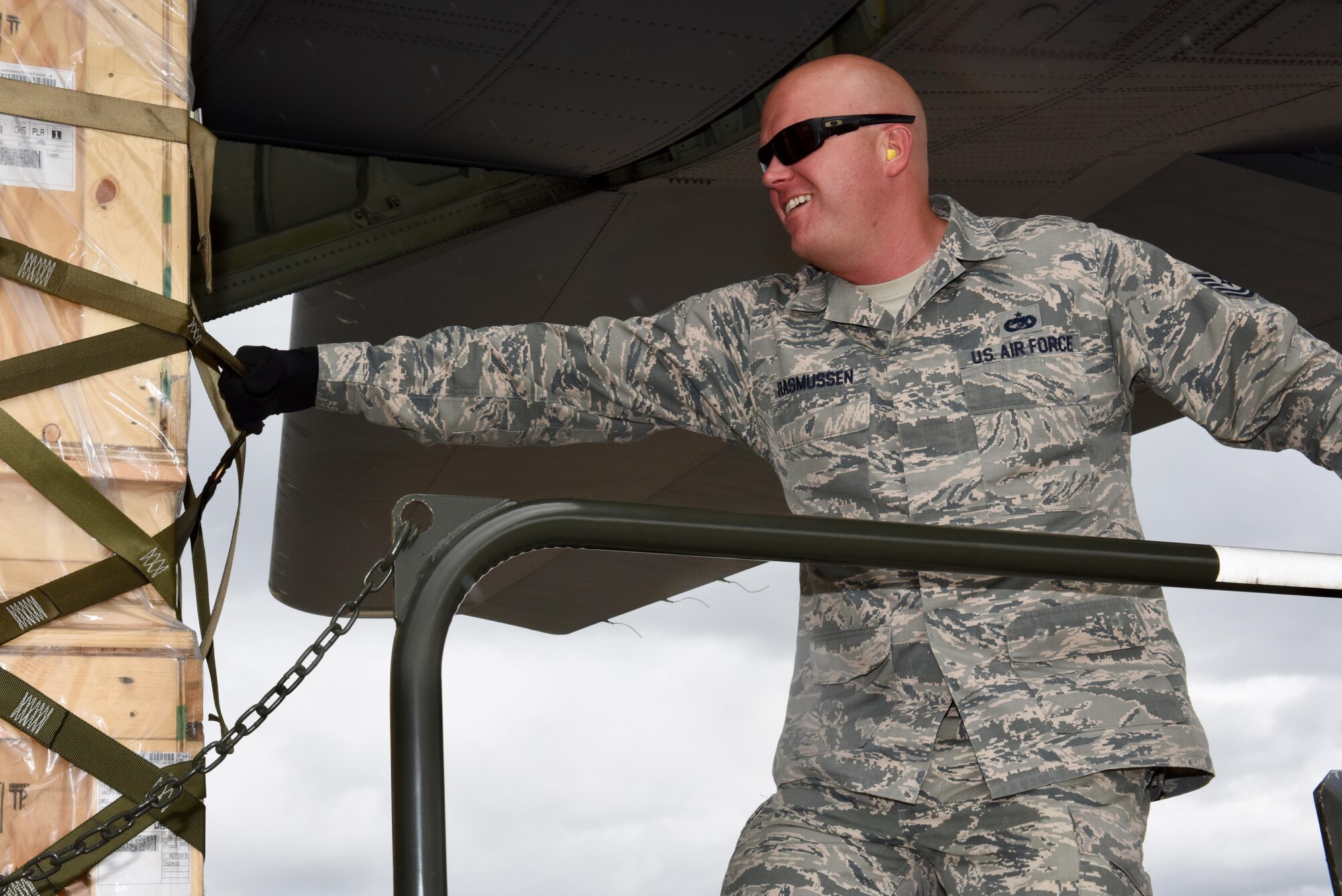 Tech. Sgt. Jonathan Resmussen, 612th Air Base Squadron, Air Transportation Operations Center section chief, pulls a pallet off the C-130J from the 317th Airlift Wing Oct. 18, 2017, at Soto Cano Air Base, Honduras.  The pallets were delivered as part of a routine channel mission delivering sustainment and equipment to Airmen stationed in the Central American country. The Airmen from the 317th Airlift Wing at Dyess Air Force, Texas, routinely support the Honduras mission, a tasking from the 618th Air Operations Center.  (Air Force photo by Master Sgt. Kristine Dreyer)
