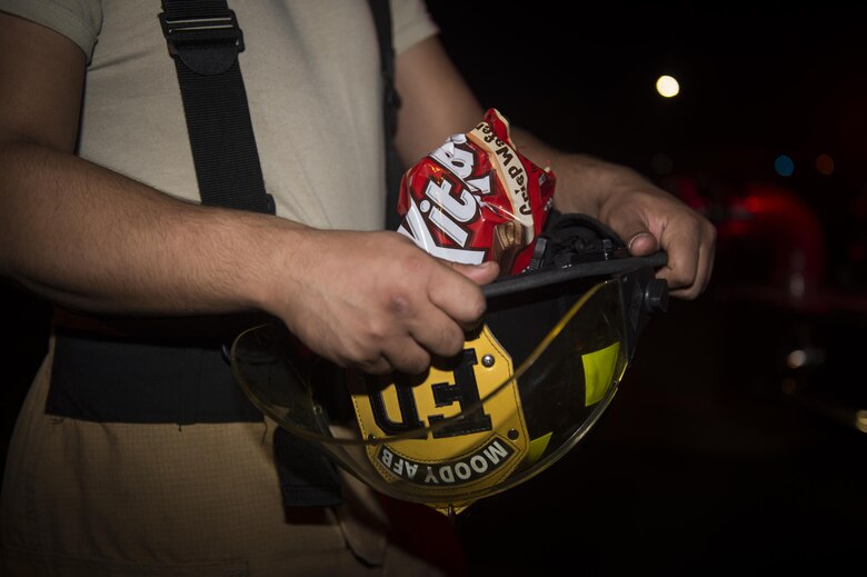 A child dressed in a costume poses for a photo during the Trunk or Treat event Oct. 20, 2017, at Moody Air Force Base, Ga. More than 3,500 Airmen and their families participated in the annual Trunk or Treat event hosted by the 23d Force Support Squadron Youth Programs. (U.S. Air Force photo by Andrea Jenkins)