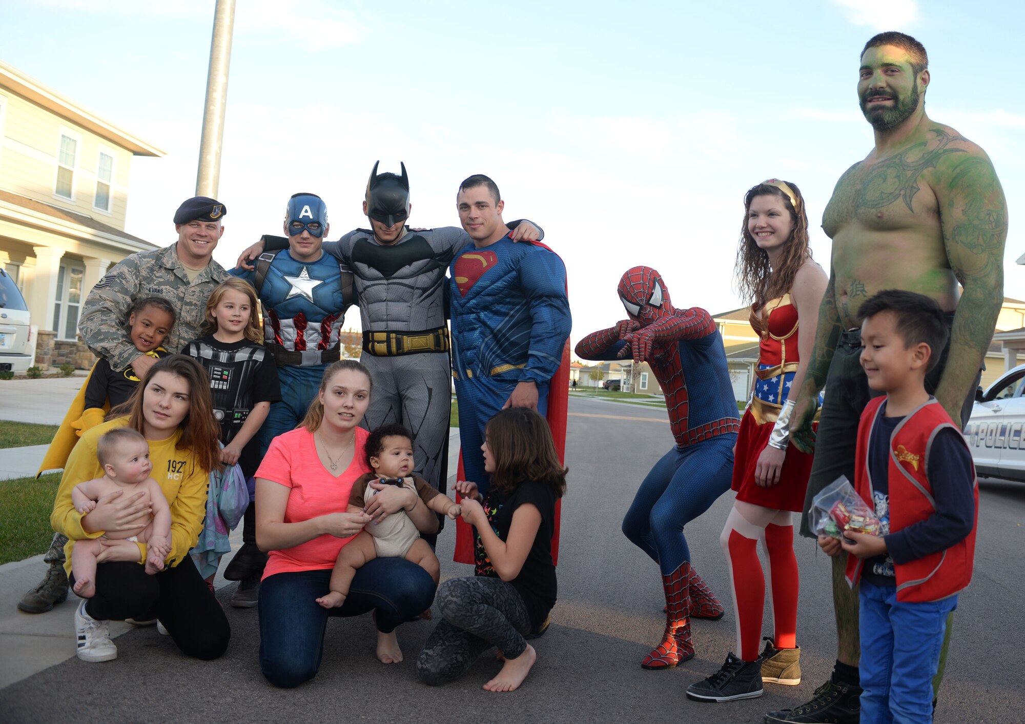 Force Protection members assigned to the 28th Security Forces Squadron stand for a picture with families from the local community during an event for Crime Prevention Month at Ellsworth Air Force Base, S.D., Oct. 11, 2017. October is when local communities and law enforcement agencies team up to help crack down on crime and make neighborhoods a safer place for everyone. (U.S. Air Force photo by Airman 1st Class Thomas Karol)