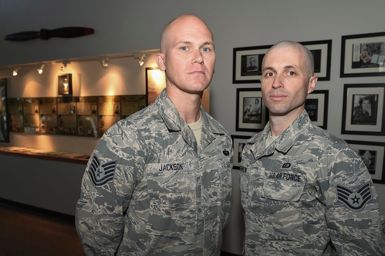 Tech Sgt. Travis Jackson and Staff Sgt. Daniel Johnson, Buckley Air Force Base Airman Leadership School instructors, pose for a photo in the Airmen Center for Excellence hallway Oct. 24, 2017, on Buckley AFB, Colo. Buckley AFB’s Airman Leadership School is expanding its capabilities in order to better support Team Buckley. (U.S. Air Force photo by Staff Sgt. Katrina M. Brisbin/Released)
