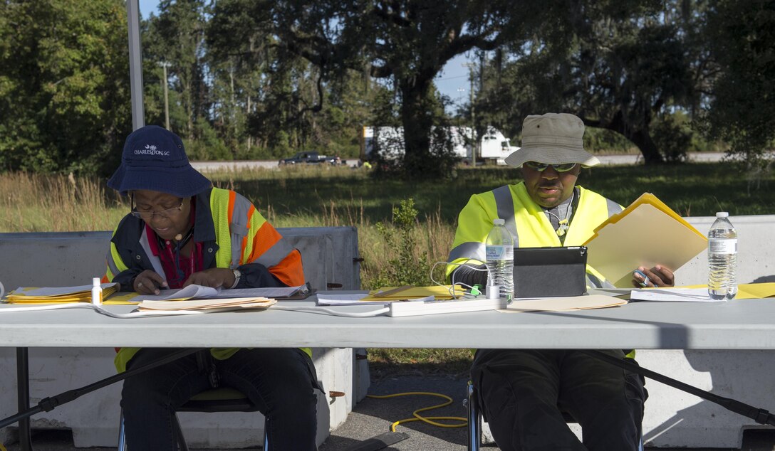 Eleanor Van Cleve and Joseph Alem, Federal Emergency Management Agency transportation managers, review paperwork of inbound cargo Oct. 21.