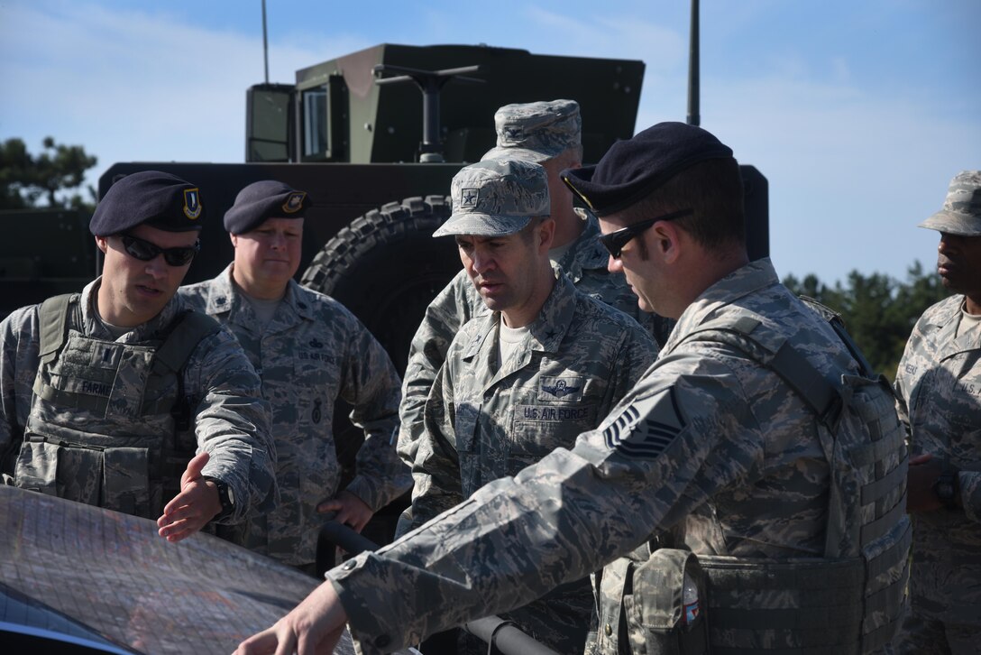 8th Security Forces personnel brief 7th AF vice commander, Brig. Gen. Lansing Pilch, on the base's air defense plan.