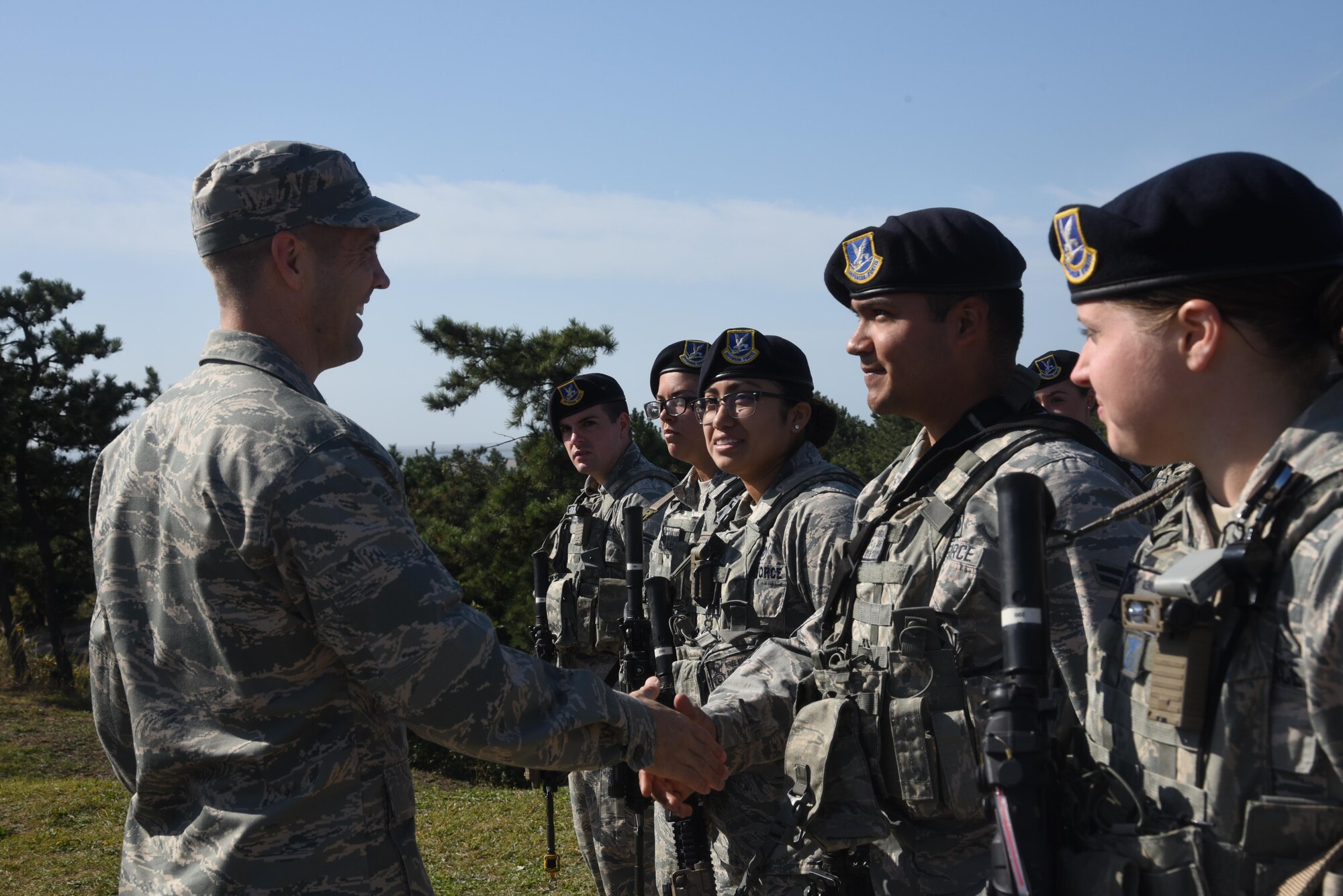 7th AF vice commander, Brig. Gen. Lansing Pilch, greets Defenders assigned to the 8th Security Forces Squadron.