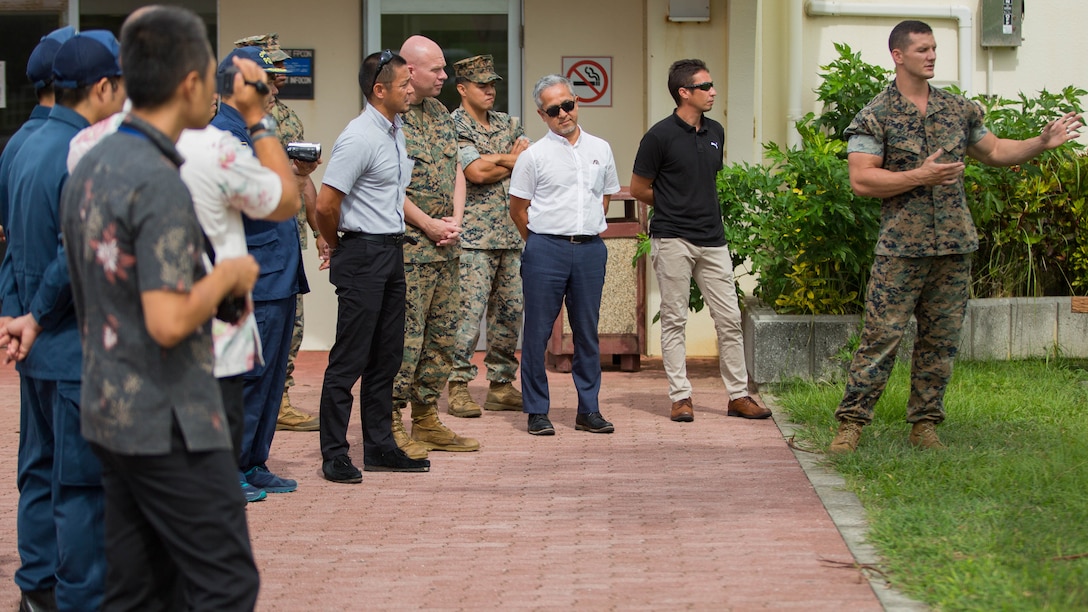 Sgt. David McCarty explains the different training during a K-9 demonstration for the Okinawa Prefectural Police.
