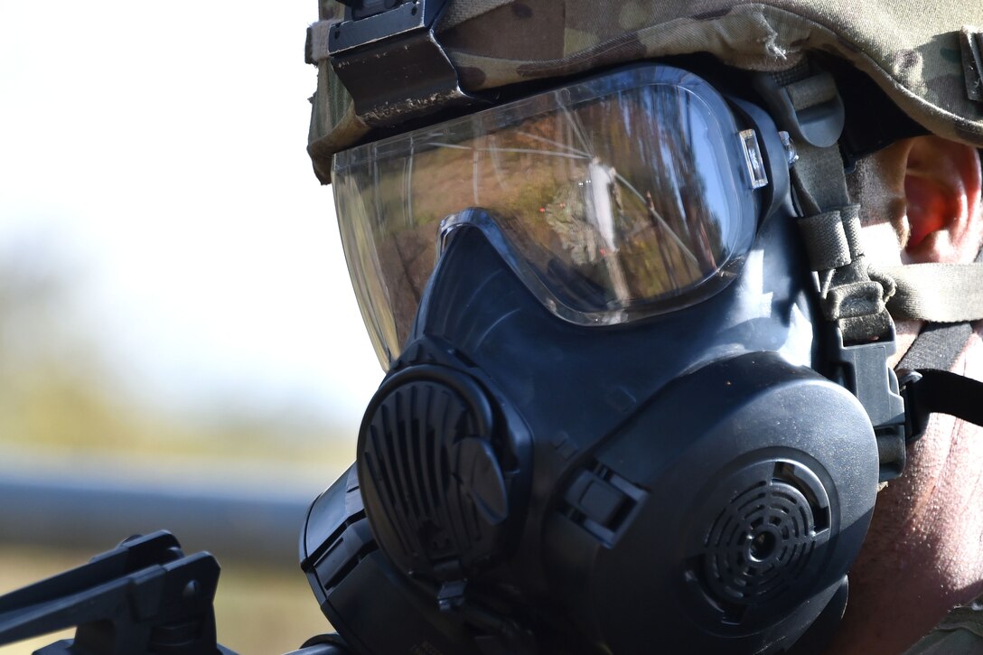 Closeup of a soldier wearing a protective mask.