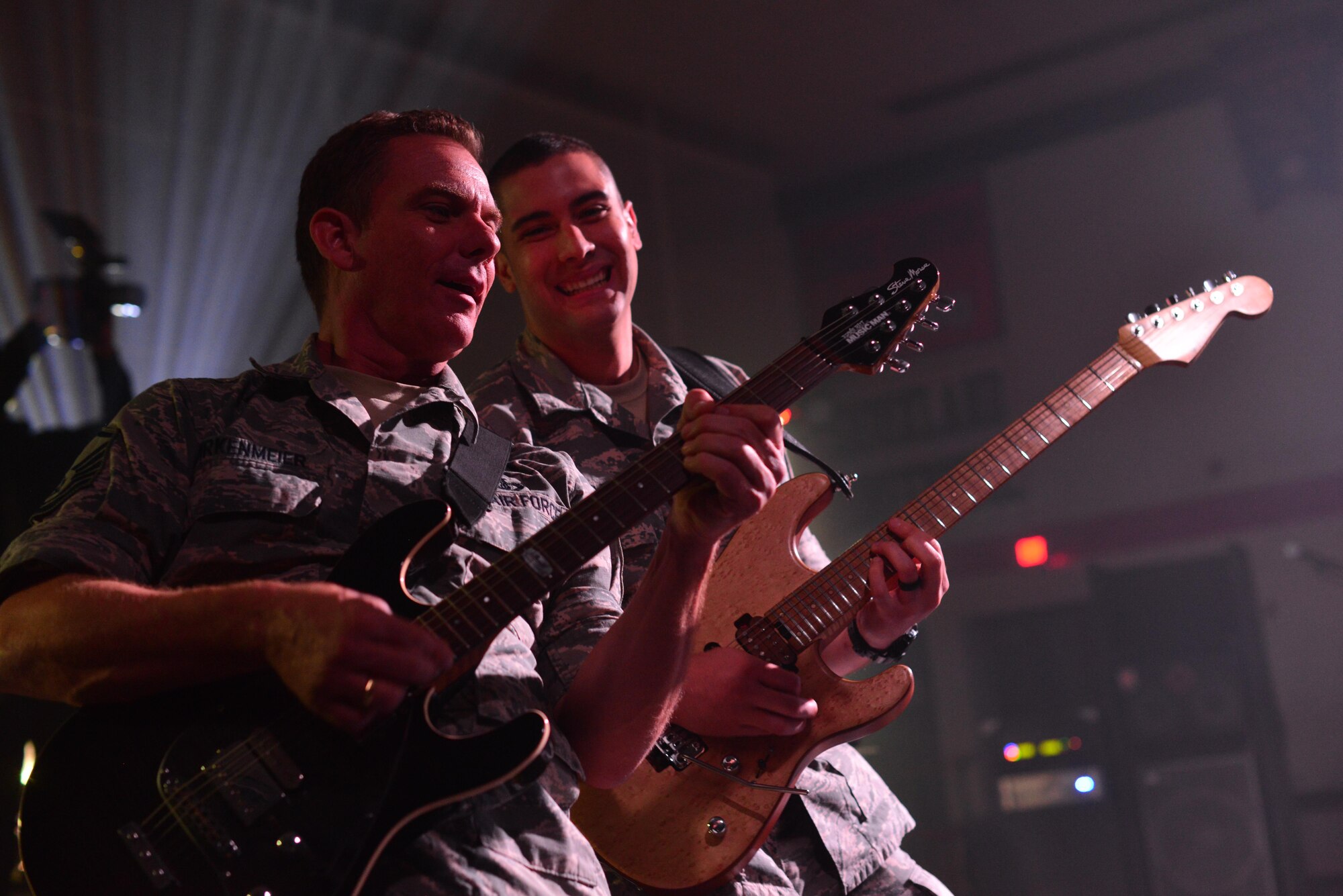 Master Sgt. Jerry Birkenmeier, left, and Staff Sgt. Alberto Rosado Perez, right, both guitarists with the Heartland of America Band’s Raptor ensemble, play to students at Sioux Center High School in Sioux Center, Iowa, Oct. 13, 2017. The ensemble partnered with local recruiters to reach high school students with the Air Force mission on the tour.