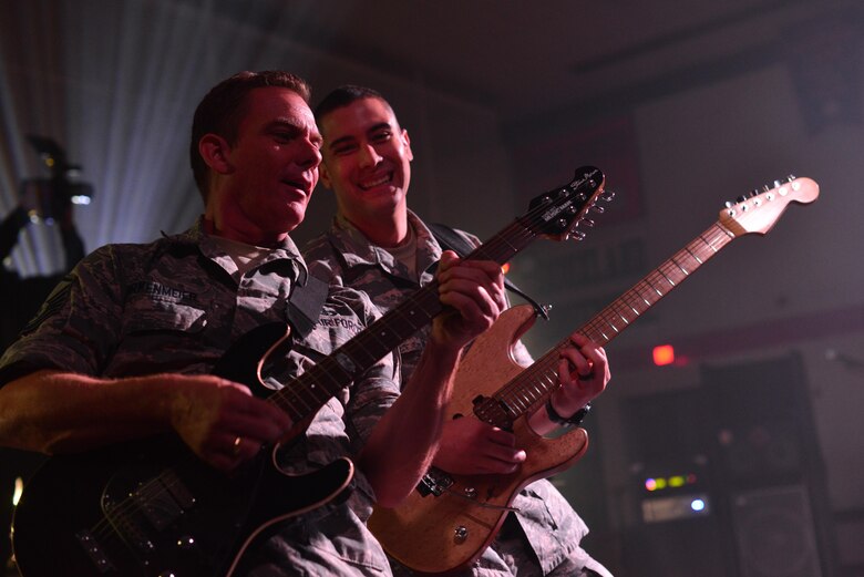 Master Sgt. Jerry Birkenmeier, left, and Staff Sgt. Alberto Rosado Perez, right, both guitarists with the Heartland of America Band’s Raptor ensemble, play to students at Sioux Center High School in Sioux Center, Iowa, Oct. 13, 2017. The ensemble partnered with local recruiters to reach high school students with the Air Force mission on the tour.