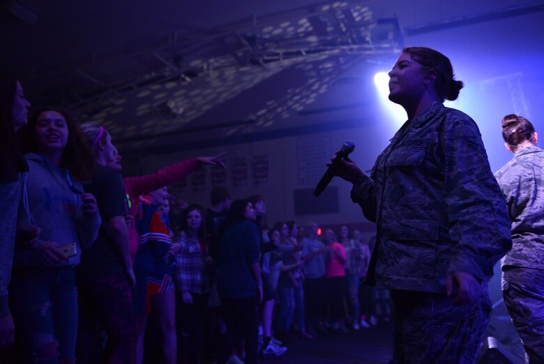 Airman 1st Class Aliyah Richling, right, a vocalist with the Heartland of America Band’s Raptor ensemble, right, pauses while singing with high schoolers at Sioux Center High School in Sioux Center, Iowa, Oct. 13, 2017. The ensemble partnered with local recruiters to reach high school students with the Air Force mission on the tour.