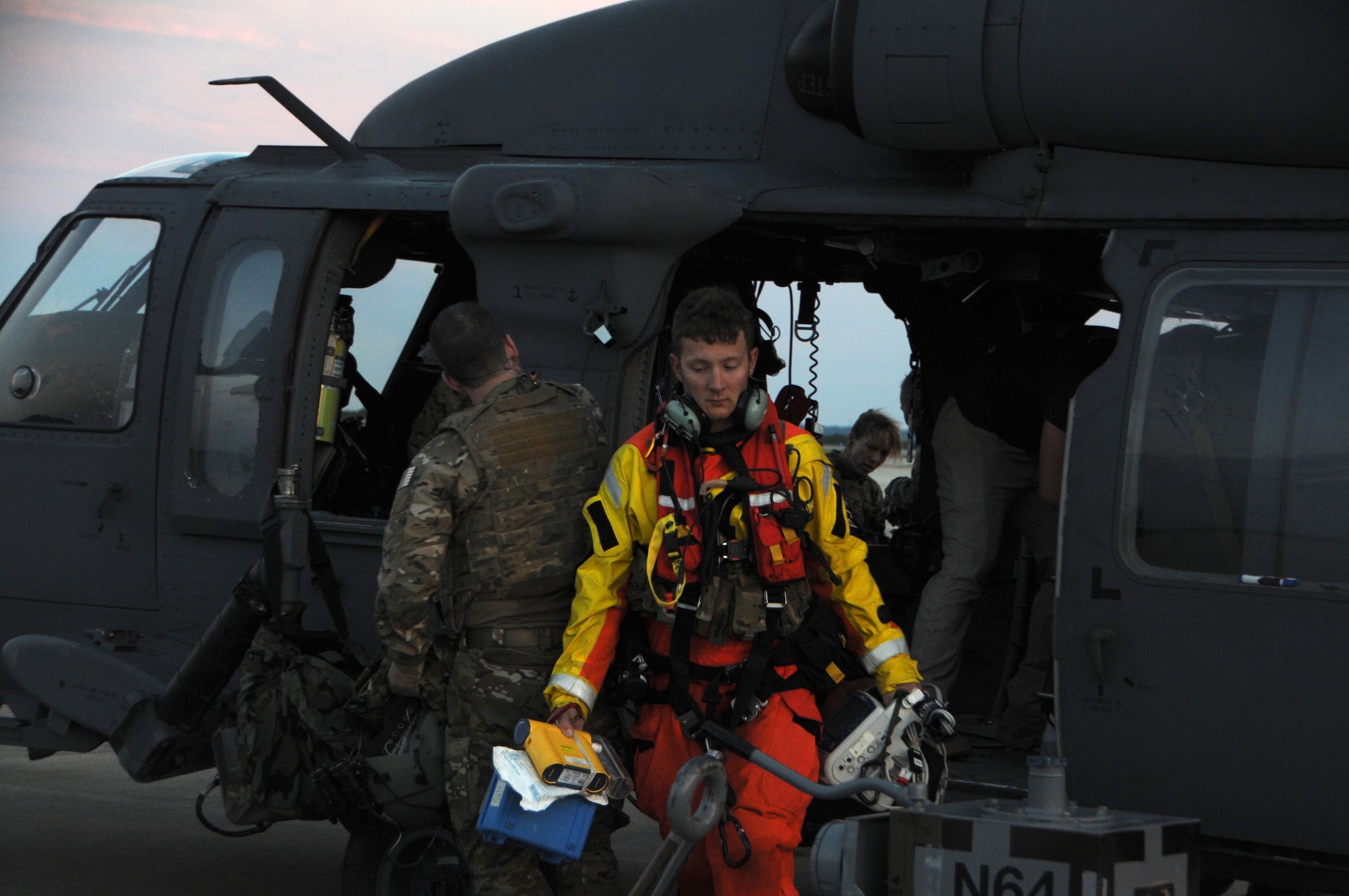 U.S. Air Force Senior Airman James M. Zambik, a pararescueman with the 103rd Rescue Squadron of the 106th Rescue Wing assigned to the New York Air National Guard, exits the HH-60 Pavehawk helicopter at Fort Hood, Texas, August 28, 2017. The efforts of Zambik and the Airmen of 106th helped save 255 people and two dogs during today’s mission. (U.S. Air National Guard photo by Airman 1st Class Daniel H. Farrell