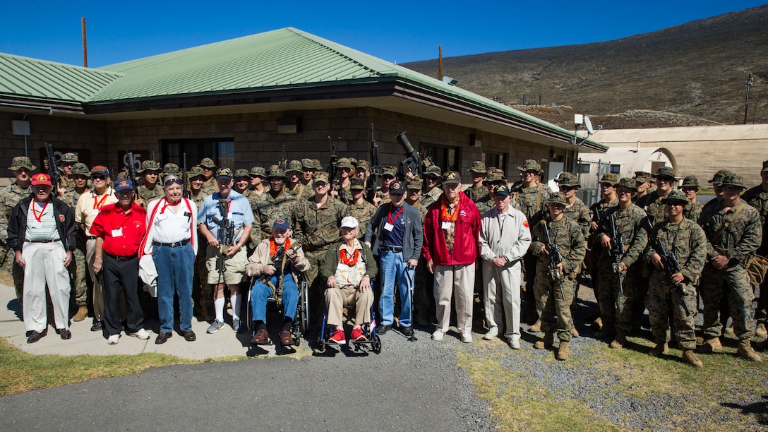 U.S. Marine veterans with the 5th Marine Division pose for a photo with U.S. Marines with 2nd Battalion, 3rd Marine Regiment.