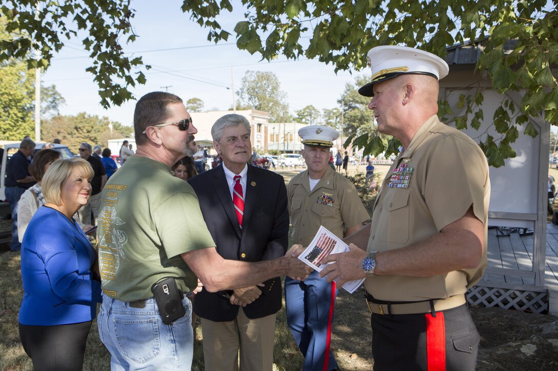 Brig. Gen. Bradley James (right), commanding general of 4th Marine Aircraft Wing, Marine Forces Reserve, shakes the hand of a Gold Star family member (center left) in Moorhead, Miss., Oct. 19, 2017. James, Gov. Phil Bryant (center), the governor of Mississippi, and his wife Deborah Bryant (left), attended a memorial that remembered the lives of the 15 Marines and one sailor who perished in a C-130 plane crash in July 2017. (U.S. Marine Corps photo by Cpl. Dallas Johnson)
