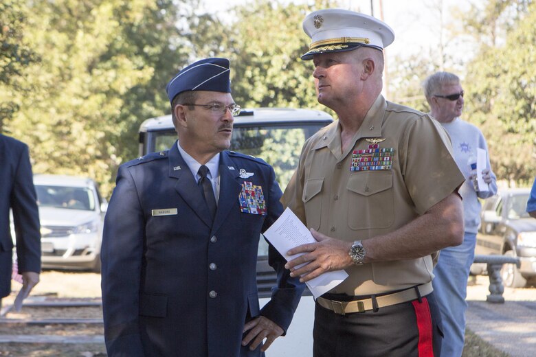 Brig. Gen. Billy Nabors (left), the Mississippi Air National Guard chief of staff, and Brig. Gen. Bradley James, commanding general of 4th Marine Aircraft Wing, Marine Forces Reserve, discuss the turnout of the memorial they are attending, in Moorhead, Miss., Oct. 19, 2017. Nabors and James attended the memorial to not only remember the 15 Marines and one sailor who perished in July 2017, but to also celebrate the 200th birthday of the state of Mississippi. (U.S. Marine Corps photo by Cpl. Dallas Johnson)