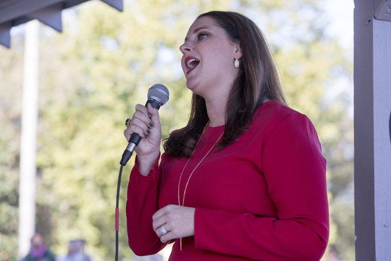 Alicia H. Truesdale, a resident of Moorhead, sings “The Star Spangled Banner” during a memorial and celebration of the states birthday, in Moorhead, Miss., Oct. 19, 2017. Leaders from 4th Marine Aircraft Wing, Marine Forces Reserve, as well as residents of Moorhead held not only a celebration for the 200th birthday of the state of Mississippi, but to also memorialize the 16 service members who perished in a C-130 aircraft crash in July 2017, in the nearby county of Leflore. (U.S. Marine Corps photo by Cpl. Dallas Johnson)