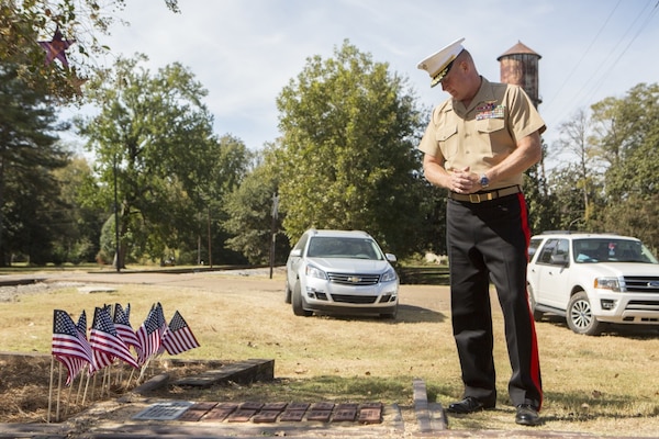 Brig. Gen. Bradley James, the commanding general of 4th Marine Aircraft Wing, Marine Forces Reserve, reads the names on bricks that were laid to memorialize the lives of the 15 Marines and one sailor who died in a C-130 plane crash in July 2017, in Moorhead, Miss., Oct. 19, 2017. James attended the memorial event that not only paid tribute to the fallen service members, but to also celebrate the 200th birthday of the state of Mississippi. (U.S. Marine Corps photo by Cpl. Dallas Johnson)