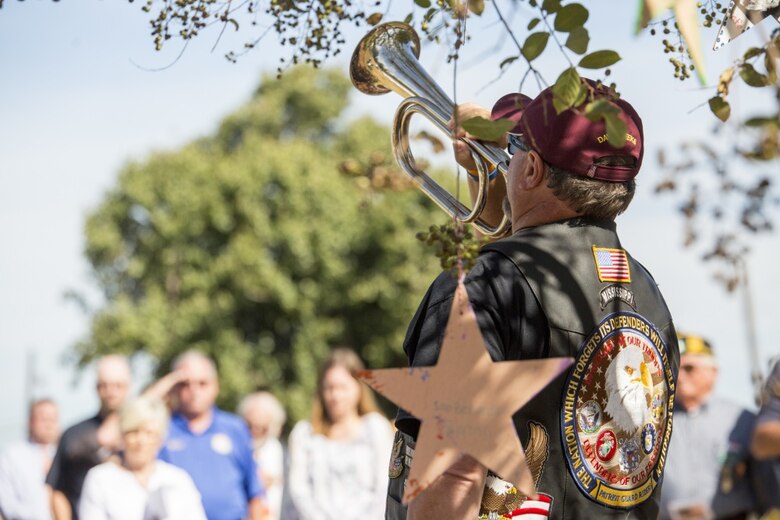 David Weeks, a member of the Patriot Guard Riders, plays “Taps” after the roll-call of the 15 Marines and one sailor who died in a C-130 plane crash in Leflore county, in Moorhead, Miss., Oct. 19, 2017. Weeks, leaders from 4th Marine Aircraft Wing, Mississippi Gov. Phil Bryant and numerous other residents of Moorhead, attended the Mississippi Bicentennial Celebration to not only celebrate the state's 200th birthday, but to honor and pay their respects to the fallen service members. (U.S. Marine Corps photo by Cpl. Dallas Johnson)