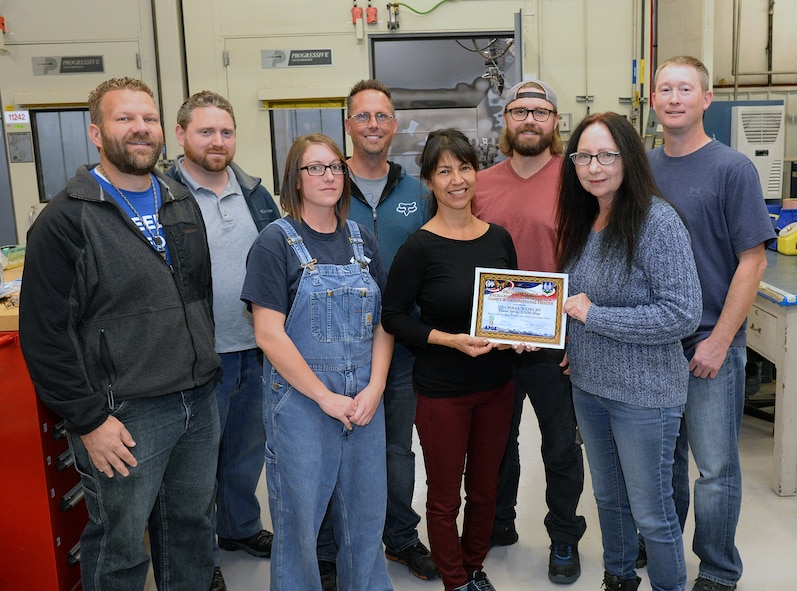 (Left to Right) Matt Farmer, Zach Walker, Francesca Roschewski, Russell Stewart, Mona Hogenson, Aaron Ames, Anita Henderson and Tally Thomas, 532nd Commodities Maintenance Squadron's flame spray/high velocity oxygen fuel shop, were recognized by Ogden Air Logistics Complex leadership Oct. 21, 2017, for accumulating more than 1,500 days of injury and accident free work days dating back to Jan. 3, 2013. (U.S. Air Force photo by Alex R. Lloyd)