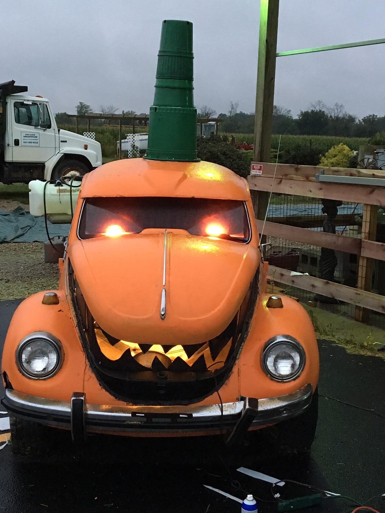 A vehicle decorated as a pumpkin sits outside Tech.Sgt. Nathan Collett's, 87th Aerial Port Squadron, family-owned and operated greenhouse as part of the aMAZEing Fall Festivals. The event features a five acre, pirate-themed corn maze, petting zoo, hay ride, giant checkerboard, bouncy houses, and more.