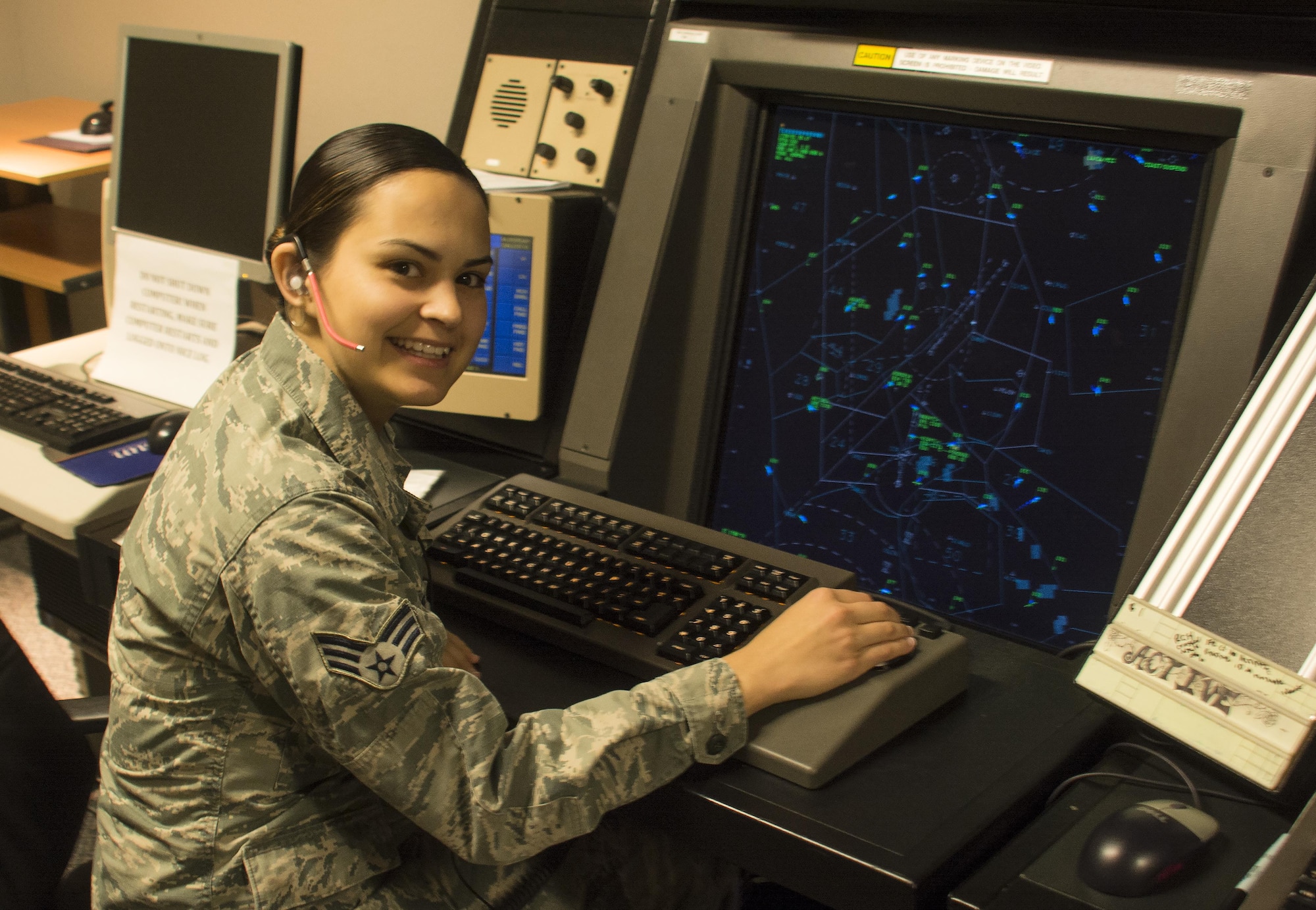 Senior Airman Marissa N. Varnes, 60th Operations Support Squadron air traffic controller, tracks the path of aircraft leaving and landing in the Travis Air Force Base airspace Oct. 24. Due to the high volume of aid offered by Travis to those devastated by recent natural disasters, the air traffic controllers on base were a greatly needed asset in projecting rapid mobility to those affected areas.