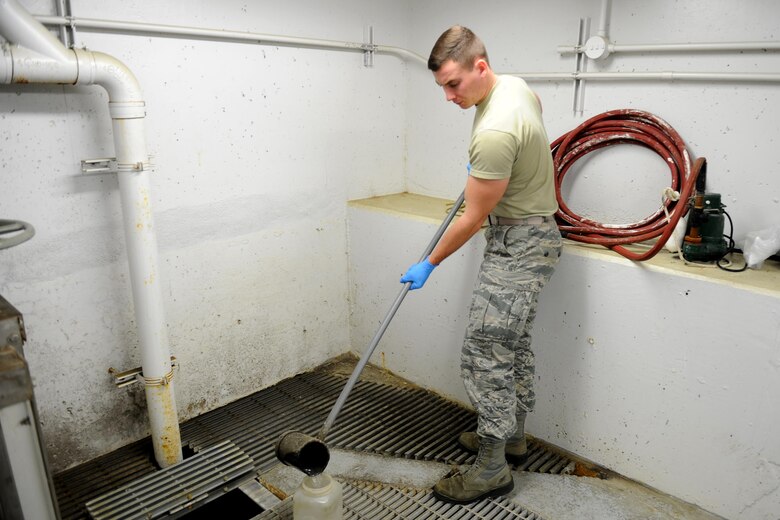 U.S. Air Force Airman 1st Class Jacob Hull, a 354th Civil Engineer Squadron waste water plant operator, gathers water for testing Oct. 19, 2017, at Eielson Air Force Base, Alaska. Waste water plant operators conduct tests three times daily to check water for its pH levels. (U.S. Air Force photo by Airman 1st Class Eric M. Fisher)