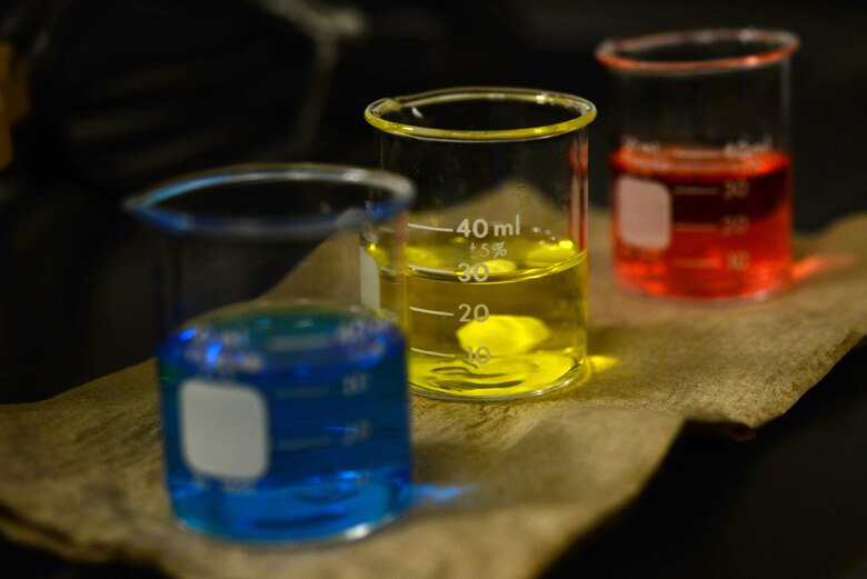 Beakers of pH buffer solution sit on a paper towel Oct. 19, 2017, at Eielson Air Force Base, Alaska. The pH buffer solution calibrates the equipment used to test water samples at the waste water plant. (U.S. Air Force photo by Airman 1st Class Eric M. Fisher)