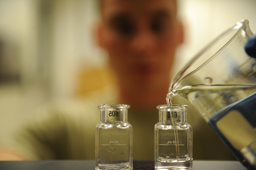 U.S. Air Force Airman 1st Class Jacob Hull, a 354th Civil Engineer Squadron waste water plant operator, pours water into a vial Oct. 19, 2017, at Eielson Air Force Base, Alaska. Waste water can be hazardous to the environment, but once it is processed through the plant it becomes safe to release without the risk of causing harm. (U.S. Air Force photo by Airman 1st Class Eric M. Fisher)