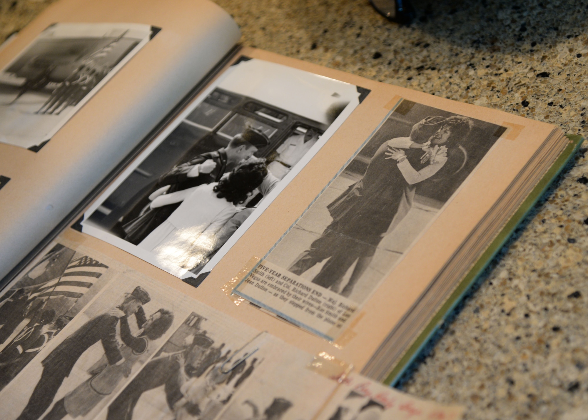 Retired Lt. Col. Richard “Gene” Smith, former 50th Flying Training Squadron Commander, flips through photos Oct. 17, 2017, in West Point, Mississippi, stopping at a photo of when he and his wife, Rae, reunited after he returned to the U.S. in 1973. Smith was a prisoner of war in Vietnam from Oct. 25, 1967 to March 14, 1973. (U.S Air Force photo by Airman 1st Class Beaux Hebert)