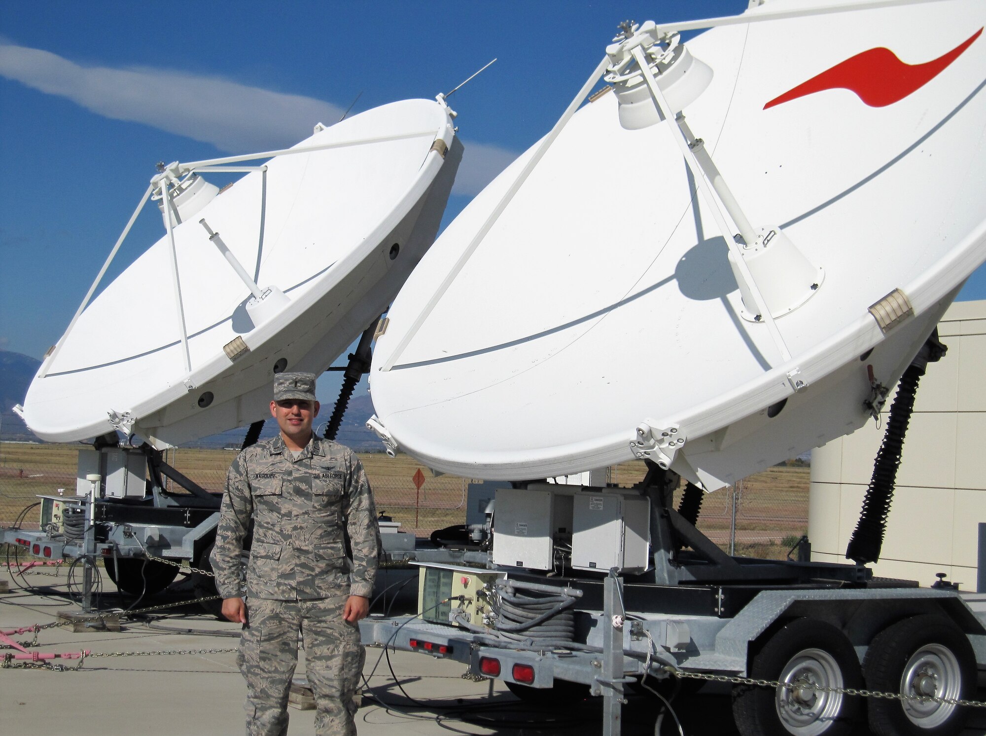 2nd Lt. Dan Vasquez, 16th Space Control Squadron crew commander, along with some of the equipment used by the 16th SPCS, Oct. 20, 2017 at Peterson Air Force Base, Colorado. The 16th SPCS defends access to the space domain by identifying, characterizing, and geolocating sources of electromagnetic interference on U.S. military and commercial satellites. (Courtesy photo)