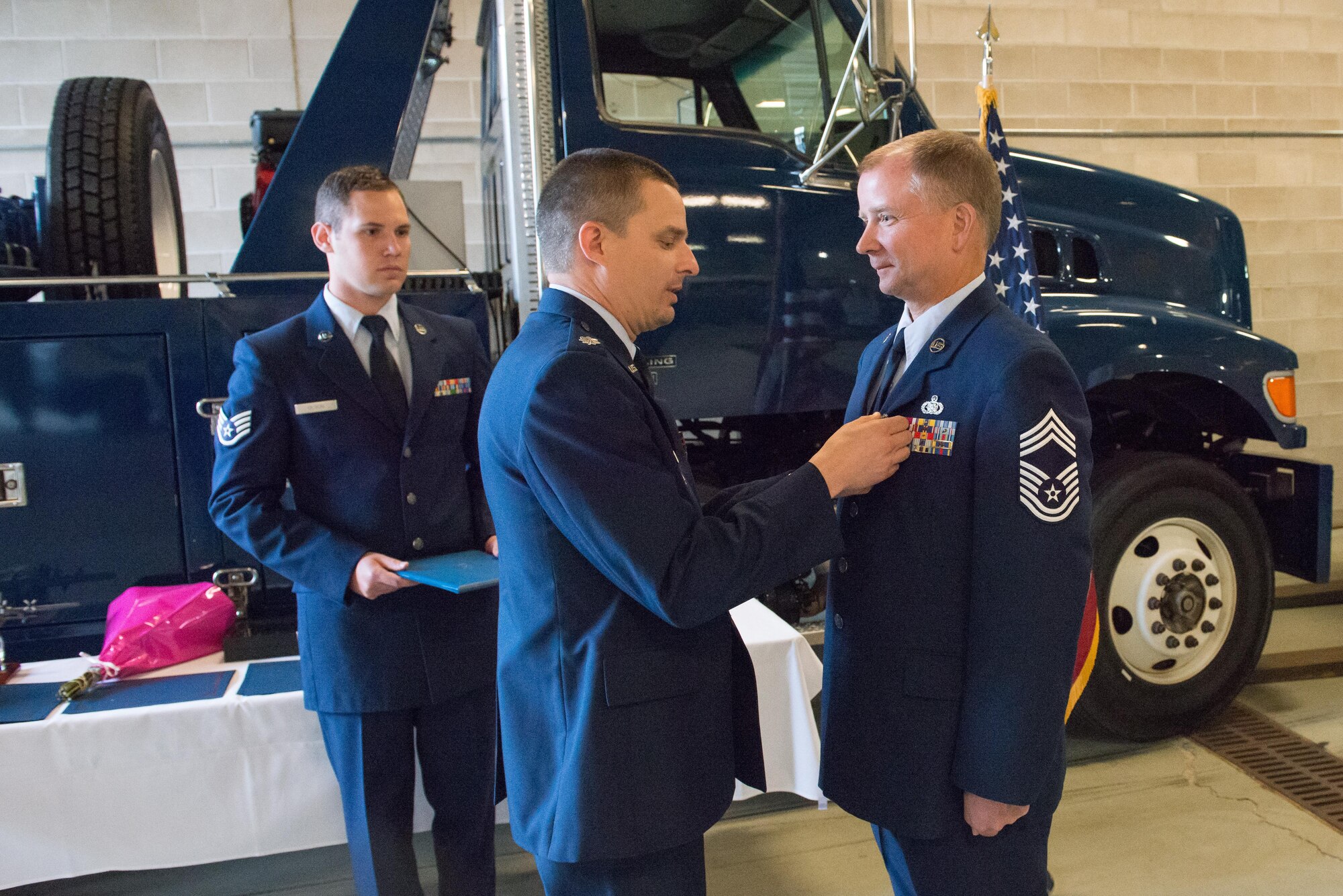 Chief Master Sgt. Jeff Nyhus is awarded the Meritorious Service Medal by Lt. Col. Andrew Staut, 934th Maintenance Group deputy commander, during his retirement ceremony Oct. 14. (Air Force Photo/Master Sgt. Eric Amidon)
