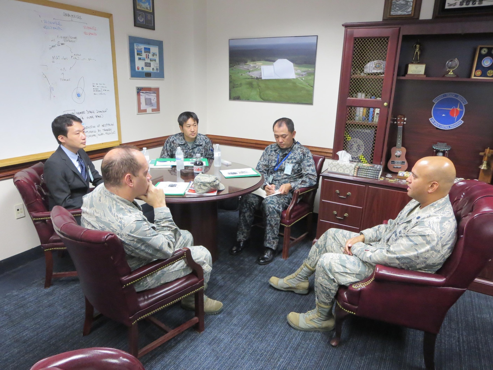 Three members of the Japanese Space Situational Awareness Policy office meet with Lt. Col. Raj Agrawal (right), 20th Space Control Squadron commander, Oct. 4, 2017, at Eglin Air Force Base, Florida. The three visitors including Lt. Col. Darrell Myers (left), Air Force branch chief for international engagement, learned about the phased array radar for the Space Mission Task Force construct, integration of intelligence and various other space surveillance capabilities. (Courtesy photo)