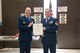 Master Sgt. Mark Graybill receives his retirement certificate from Lt. Col. Edward Buck, 934th Aerial Port Squadron commander, Oct. 15. (Air Force Photo/Master Sgt. Eric Amidon)