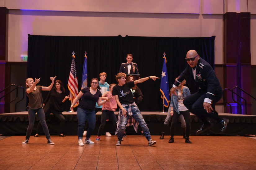Col. Jimmy Canlas, 437th Airlift Wing commander, shows off his dance moves as an ice breaker during Col. Jeffery Nelson, 628th Air Base Wing commander’s, speech at the Air Force Ball in the Charleston Area Convention Center in North Charleston, S.C., Oct. 21, 2017.