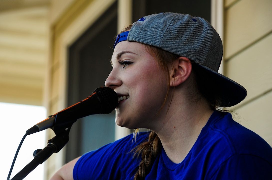 U.S. Air Force Senior Airman Hannah Walker, 633rd Force Support Squadron food service journeyman, sings live music at the Langley Marina on Joint Base Langley-Eustis, Va., Sept. 23, 2017.
