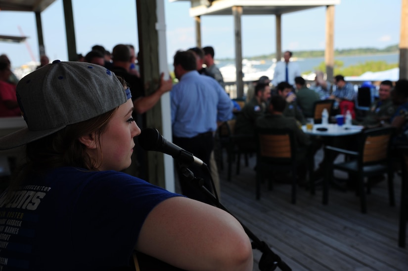 U.S. Air Force Senior Airman Hannah Walker, 633rd Force Support Squadron food service journeyman, performs live music at the Langley Marina on Joint Base Langley-Eustis, Va., Sept. 23, 2017.