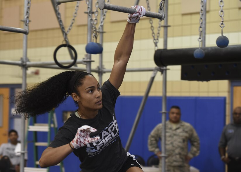 U.S. Air Force 2nd Lt. Nicole Mitchell, 83rd Network Operations Squadron directory services officer in charge, swings across the Battle Rig broken bars during the Alpha Warrior Northeast Regional Competition at Joint Base Langley-Eustis, Va., Oct. 21, 2017.