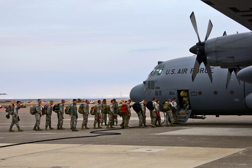 Members of the 219th RED HORSE Squadron of the Montana Air National Guard board a 120th Airlift Wing C-130 Hercules transport aircraft in Great Falls, Mont., Oct. 11, 2017. The heavy construction specialists deployed to the United States territory of Puerto Rico to assist with Hurricane Maria relief efforts. (U.S. Air National Guard photo/Senior Master Sgt. Eric Peterson)