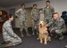 Maj. Regina Owen, 436th Medical Operations Squadron psychiatric mental health nurse practitioner, introduces Lt. Col. Goldie, a nine-year-old Golden Retriever therapy dog stationed at Walter Reed National Military Medical Center, Bethesda, Md., to members of the 436th Comptroller Squadron, Oct. 19, 2017, on Dover Air Force Base, Del. As part of Family Advocacy’s outreach during Domestic Violence Awareness Month, Owen escorted Goldie around the base to meet with Team Dover personnel during his temporary duty assignment to Dover. (U.S. Air Force photo by Roland Balik)