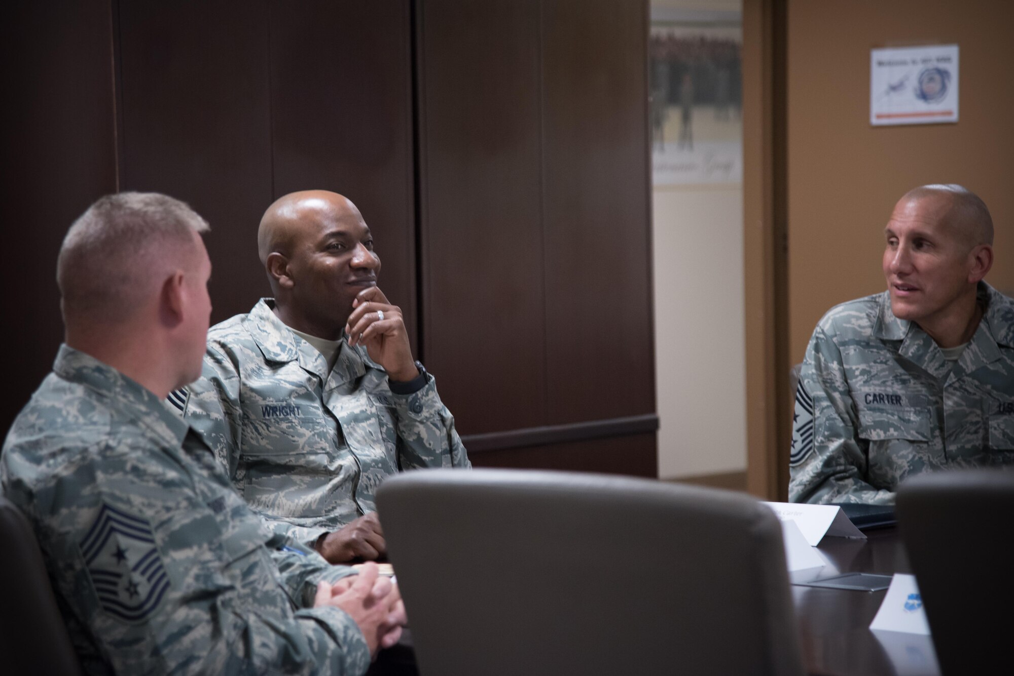 Chief Master Sergeant of the Air Force Kaleth O. Wright listens to the 403rd Wing mission brief presented by Senior Master Sgt. Thomas Lassabe, 403rd Maintenance Squadron, during his visit to the 403rd Wing Oct. 25, 2017 at Keelser Air Force Base, Mississippi. (U.S. Air Force photo/Staff Sgt. Heather Heiney)