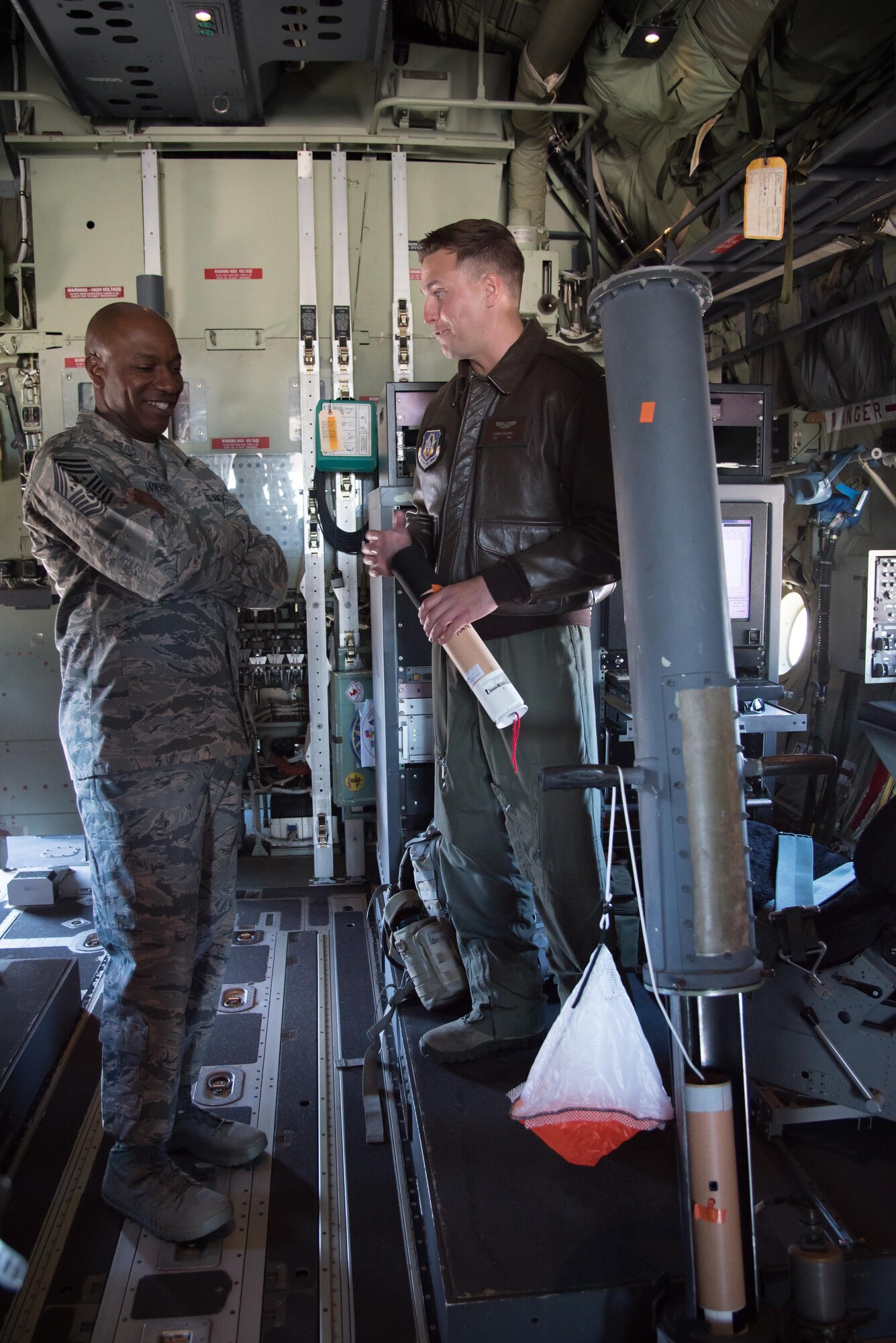 Chief Master Sergeant of the Air Force Kaleth O. Wright learns about the 53rd Weather Reconnaissance Squadron Hurricane Hunters from Staff Sgt. Nathan Calloway, 53rd WRS loadmaster, during his visit to the 403rd Wing Oct. 25, 2017 at Keelser Air Force Base, Mississippi. (U.S. Air Force photo/Staff Sgt. Heather Heiney)