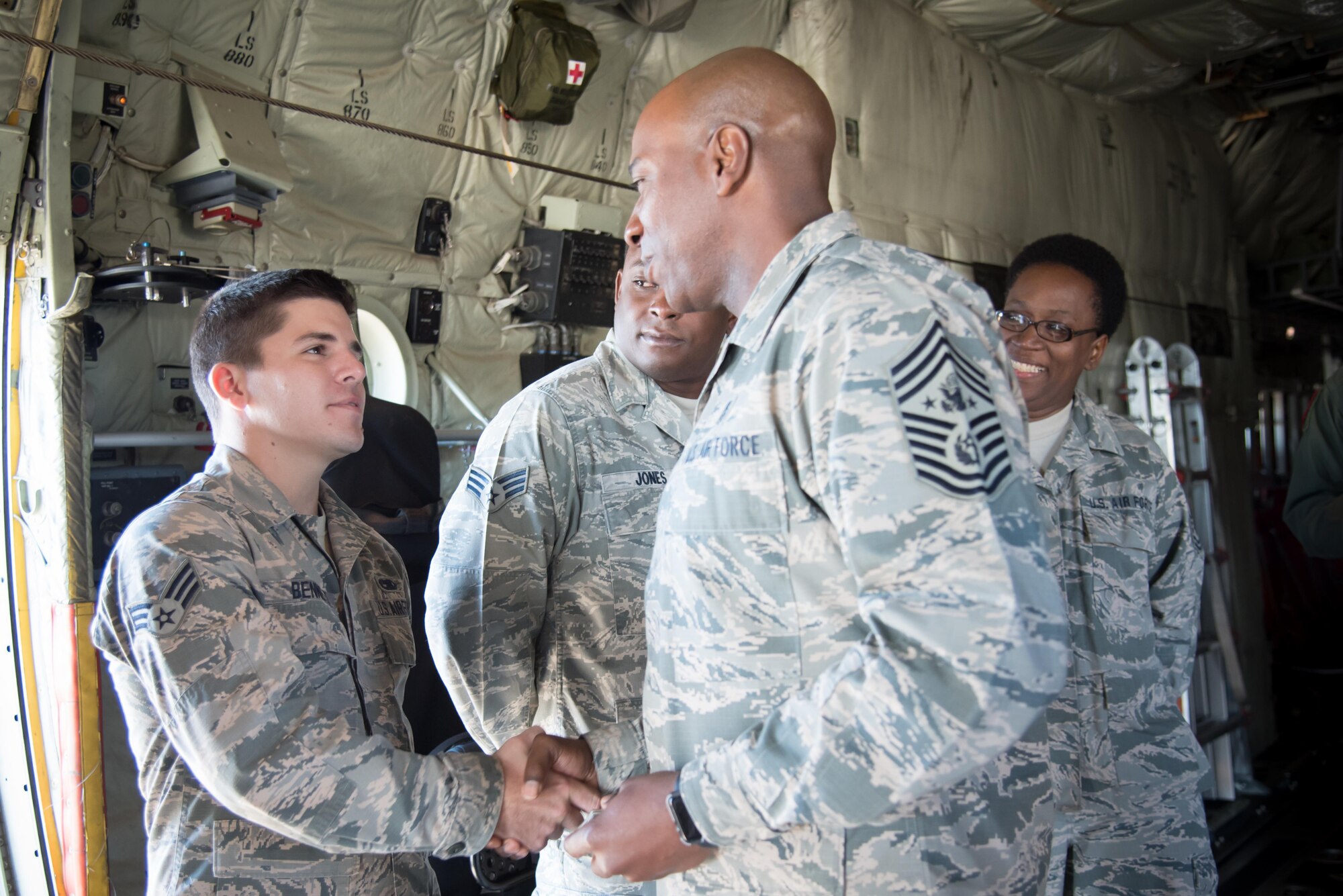 Chief Master Sergeant of the Air Force Kaleth O. Wright presents a coin to Senior Airman Cayce Bennett, 403rd Maintenance Squadron, during his visit to the 403rd Wing Oct. 25, 2017 at Keelser Air Force Base, Mississippi. (U.S. Air Force photo/Staff Sgt. Heather Heiney)