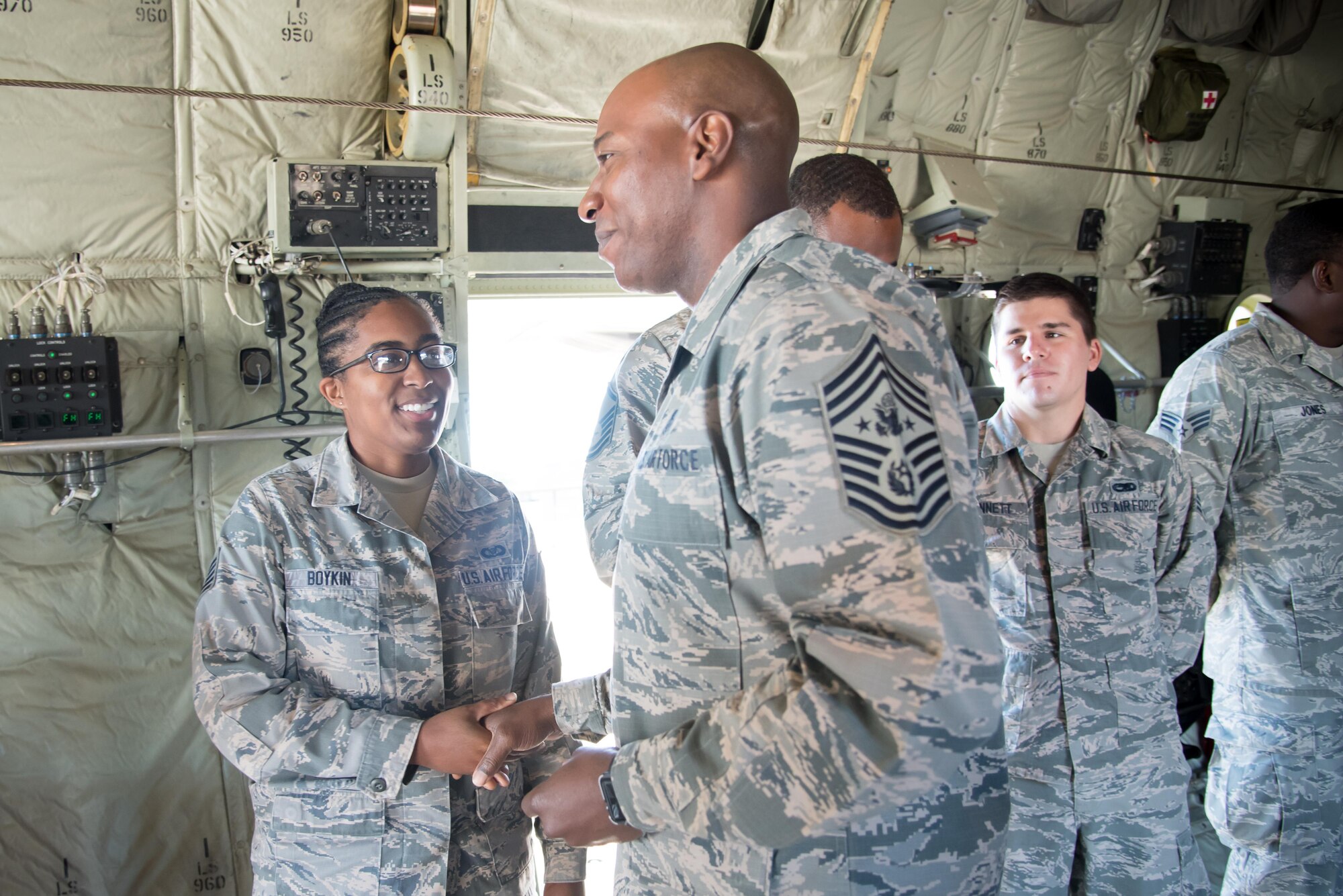 Chief Master Sergeant of the Air Force Kaleth O. Wright presents a coin to Tech. Sgt. Jeranda Boykin, 815th Airlift Squadron, during his visit to the 403rd Wing Oct. 25, 2017 at Keelser Air Force Base, Mississippi. (U.S. Air Force photo/Staff Sgt. Heather Heiney)