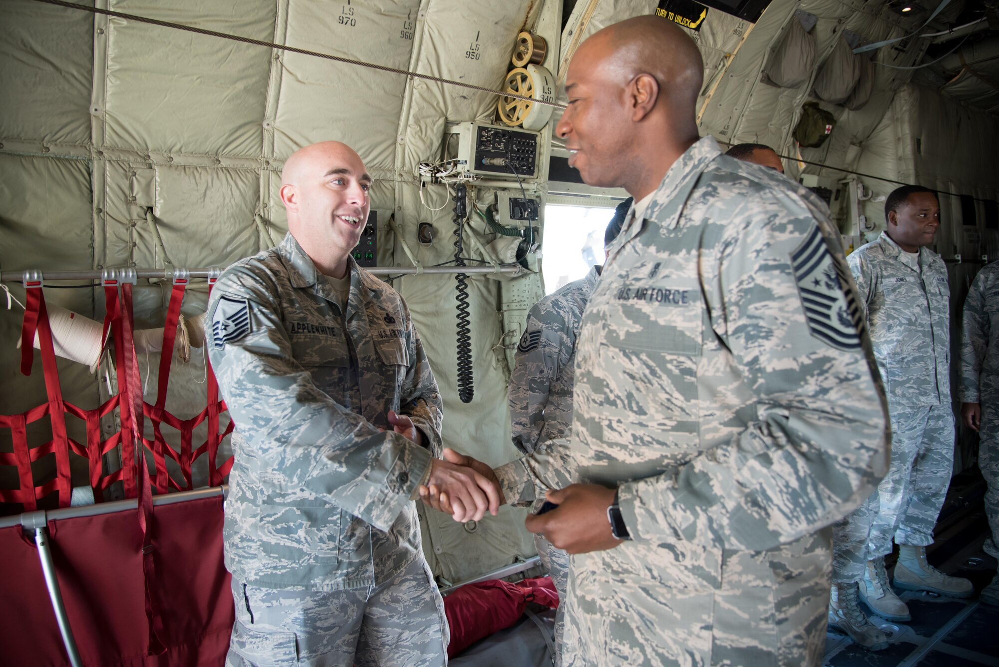 Chief Master Sergeant of the Air Force Kaleth O. Wright presents a coin to Master Sgt. Lucas Applewhite, 403rd Security Forces Squadron during his visit to the 403rd Wing Oct. 25, 2017 at Keelser Air Force Base, Mississippi. (U.S. Air Force photo/Staff Sgt. Heather Heiney)