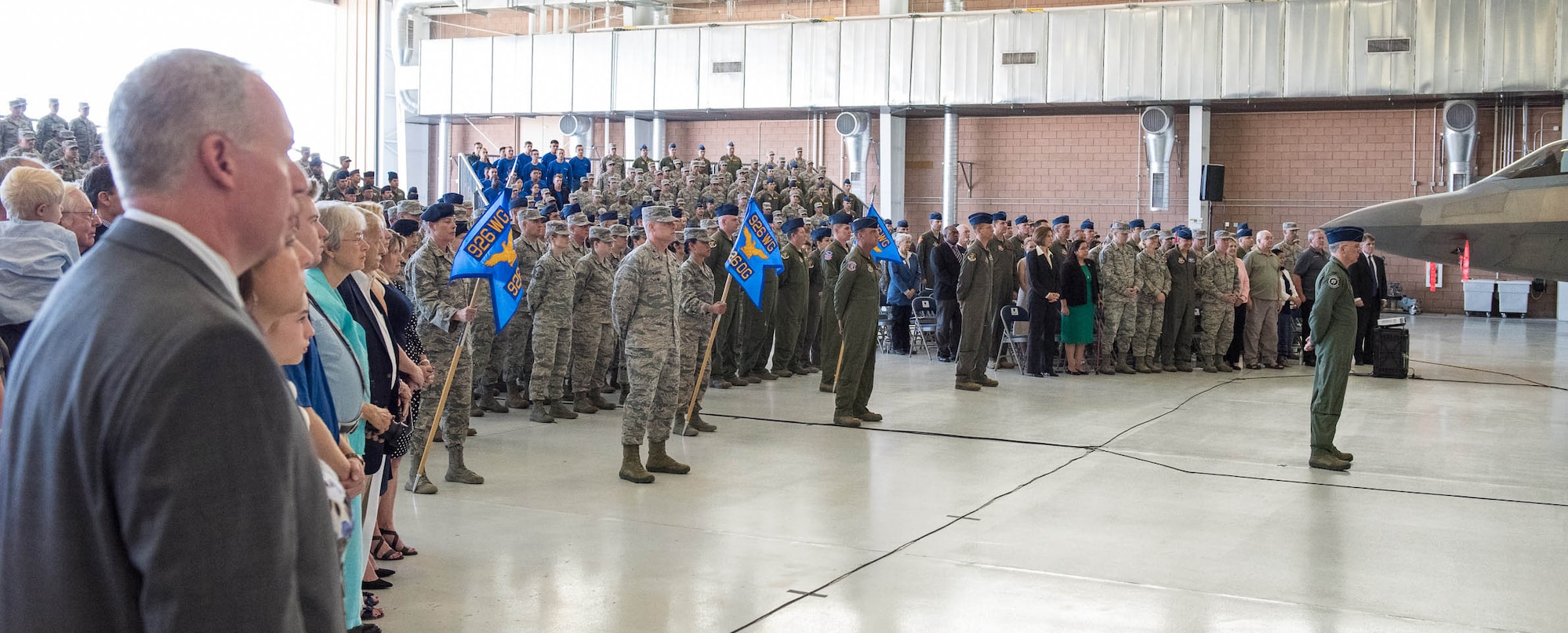 A formation of 926th Wing members prepare to present Col. Michael Schultz with his first salute during a Change of Command ceremony at the Lightning hangar. Schultz took command from Col. Ross Anderson on Oct. 14.