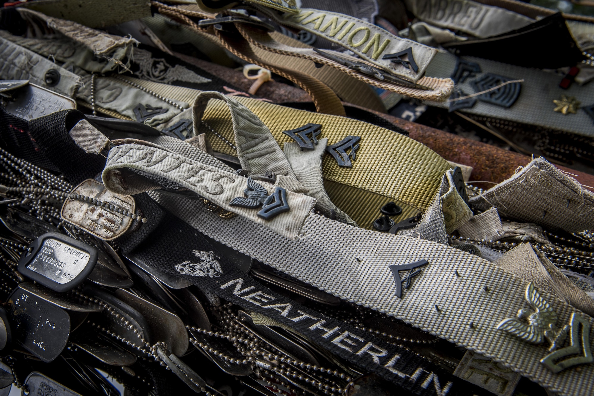 Mementos hang on an iron post in front of the Marine Memorial Mt. Suribachi, Oct. 17, 2017, at Iwo To, Japan.