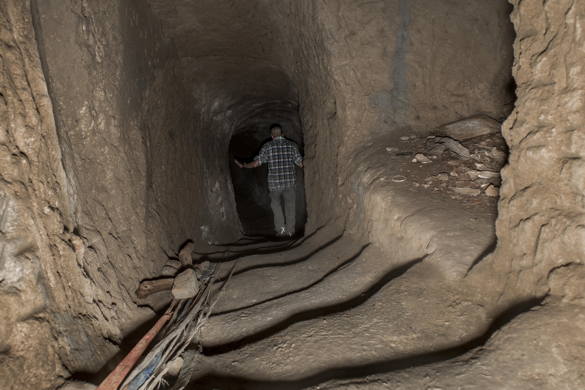 A member of Team Yokota walks down a tunnel passage way, Oct. 17, 2017, at Iwo To, Japan.