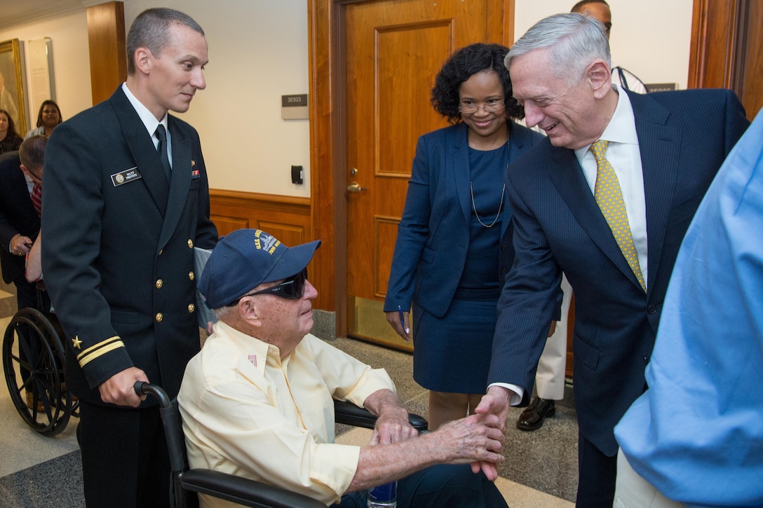 Defense Secretary Jim Mattis speaks with a survivor of the USS Arizona.