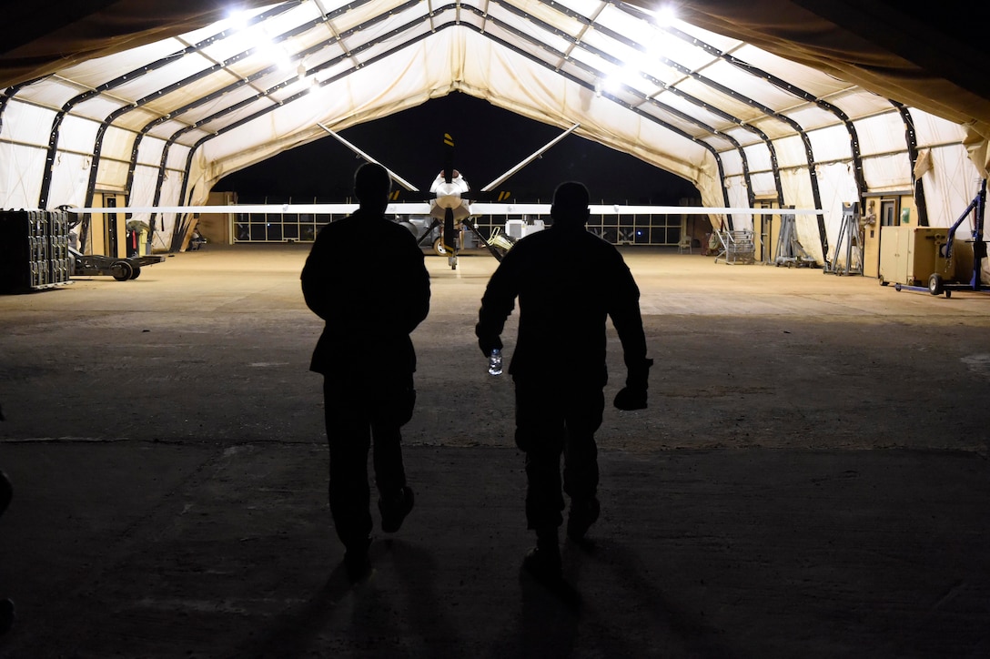 Third Air Force/17th Expeditionary AF commander (right) walks with 323rd Expeditionary Reconnaissance Squadron commander toward MQ-9 Reaper, at Nigerien Air Base 101, Niger, October
19, 2017 (U.S. Air Force/Joshua R.M. Dewberry)