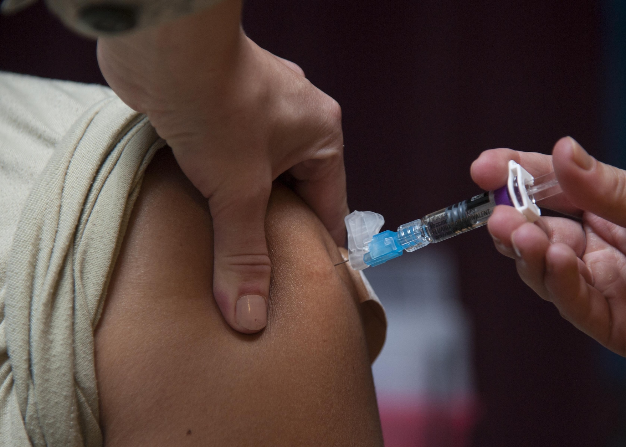 An influenza vaccination is administered to an Airman at Kirtland Air Force Base, N.M., Oct. 24. A dose of flu vaccine is recommended every flu season, and children six months through 8 years old may need two doses during the same flu season. (U.S. Air Force photo by Staff Sgt. J.D. Strong II)