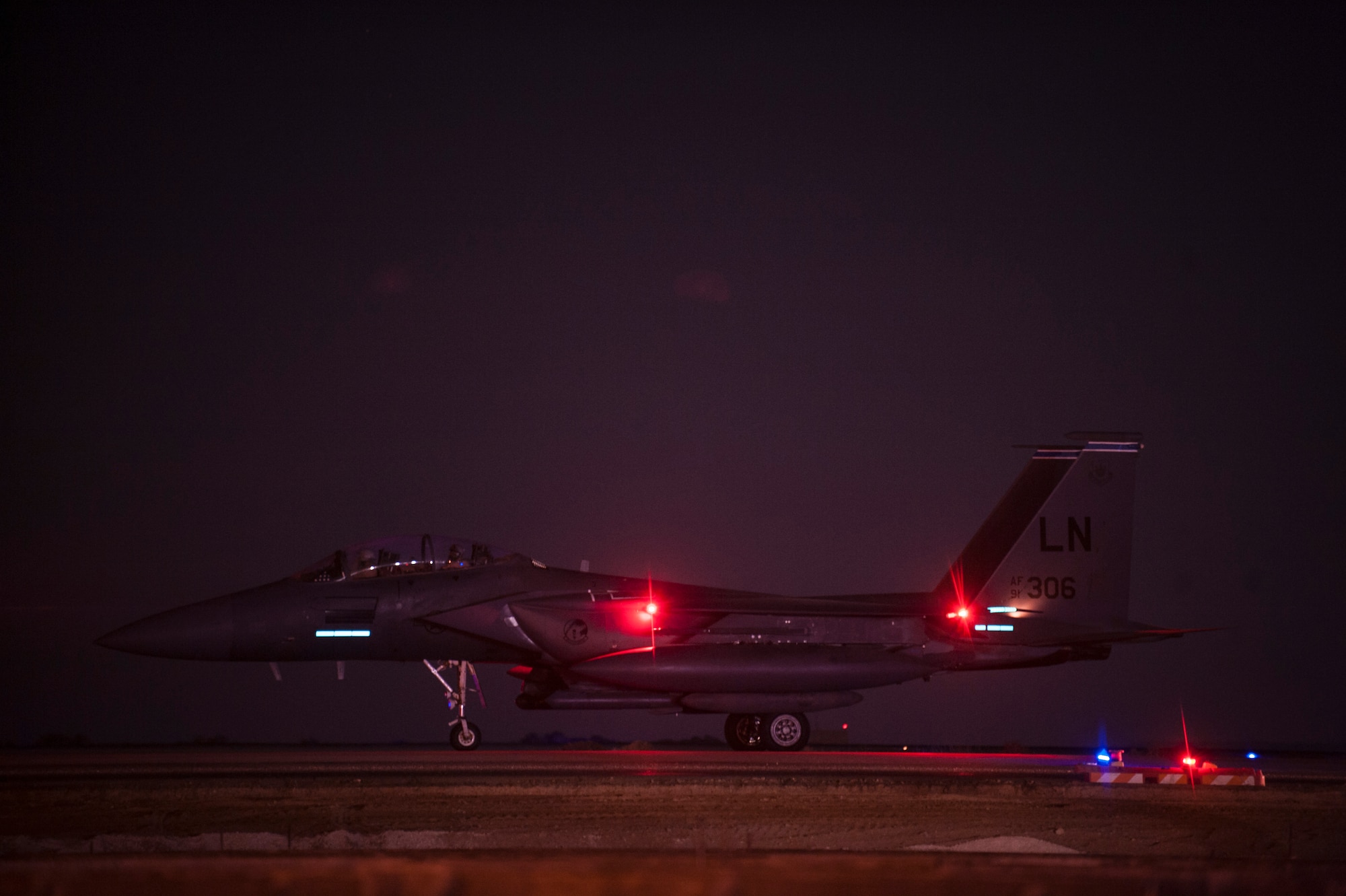 An F-15E Strike Eagle assigned to the 492nd Expeditionary Fighter Squadron awaits clearance for one final takeoff as it departs an undisclosed location in Southwest Asia after a six-month deployment. The Strike Eagle is a multi-role, all-weather fighter designed to perform both air-to air and tactical ground attack missions to a high degree of precision.