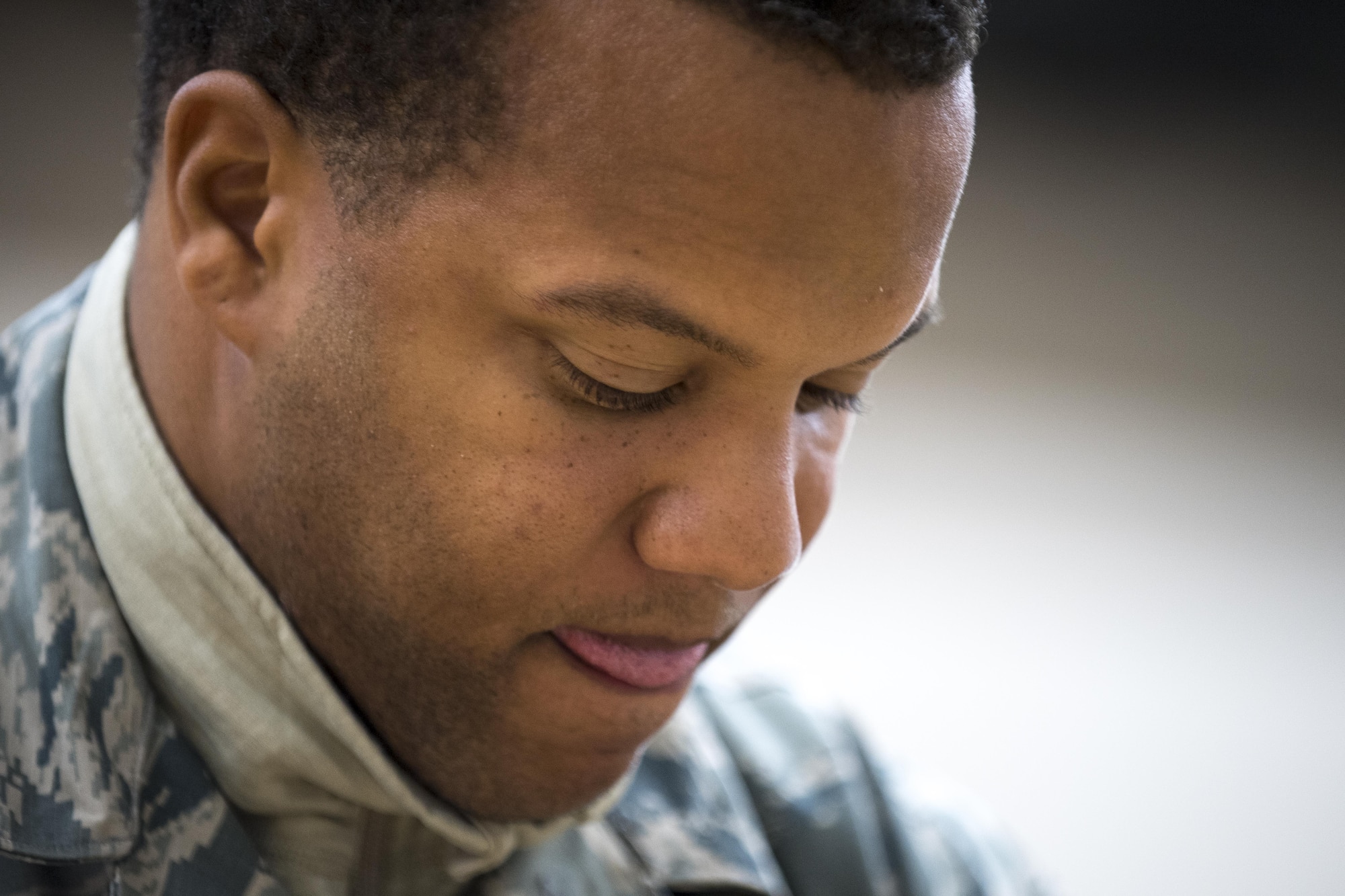 U.S. Air Force Airman 1st Class Jayson Fox, 86th Operations Support Squadron Aircrew Flight Equipment technician, focuses as he packs a parachute on Ramstein Air Base, Germany, Oct. 24, 2017. Fox said his favorite part of working in AFE is packing parachutes because it keeps him engaged. (U.S. Air Force photo by Senior Airman Devin Boyer)