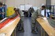 U.S. Air Force Airmen 1st Class Ricardo Nazario-Colom and Jayson Fox, 86th Operations Support Squadron Aircrew Flight Equipment technicians, prepare personnel parachutes for packing on Ramstein Air Base, Germany, Oct. 24, 2017. Aircrew Flight Equipment technicians follow a strict checklist to make sure the parachutes are operable before packing them. (U.S. Air Force photo by Senior Airman Devin Boyer)
